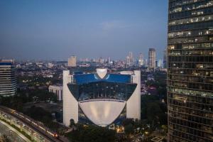 a view of a building with a view of a city at Gran Meliá Jakarta in Jakarta
