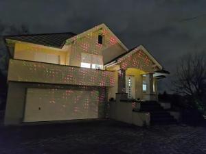 a house with christmas lights on the side of it at Suite DT4 in Blotzheim