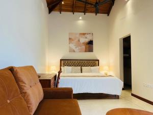 a bedroom with a bed and a couch at Eden Collection Thalpe in Talpe +64 photos