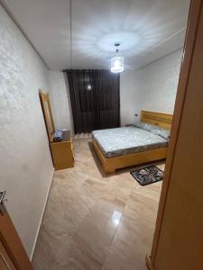 a bedroom with a bed and a window in it at Apartment Selouane in Selouane +1 photo