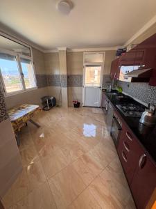 a kitchen with a stove and a counter top at Apartment Selouane in Selouane
