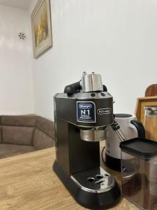 a coffee maker sitting on top of a table at Te Pishat in Brezovica