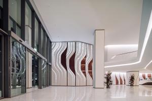 a lobby with a large wall of glass at ME by Meliá Dubai Residences in Dubai