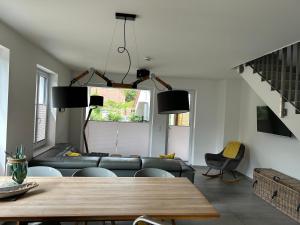 a living room with a couch and a table at Reusenhaus Nord in Breege