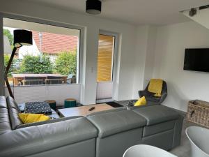 a living room with a couch and a table at Reusenhaus Nord in Breege