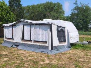 a tent is set up in a field at Szentkút Kemping Vasvár in Vasvár +26 photos