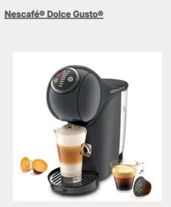 a black coffee maker with a cup of coffee at Seehäusl mit Badeplatz in Tegernsee