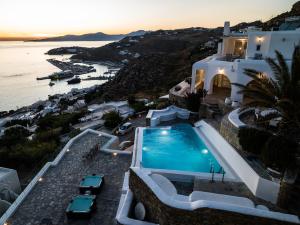 an aerial view of a villa with a swimming pool at Eagles Nest Mykonos Suites & Apartments - Shared Pool & Jacuzzis in Mikonos