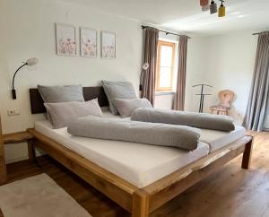 two beds sitting on top of a bed in a room at Allgäuer Ferienhäusle in Argenbühl