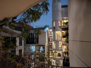 a view of a building with a white pole at Family's penthouse in Dhaka
