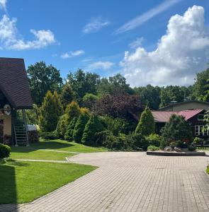 a driveway in front of a house at Classic Car Museum Apartment in Riga