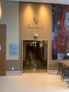 a building with a large sign on the wall at Flat Sofisticado no Jade Hotel Home Office in Brasília +108 photos