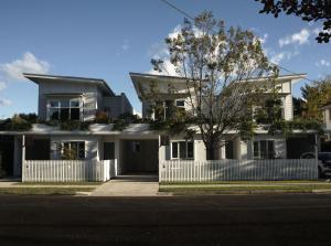 a white house with a white fence at Maple & Rubus, Berry - by Linnaeus Collection in Berry