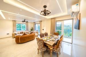 a living room with a table and a couch at Earth by The StayCationer in Dehradun