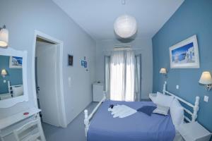 Llit o llits en una habitació de Nostos Beach