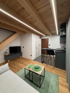 a living room with a couch and a table at Stella Alpina in Žabljak