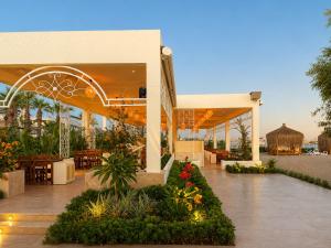 a lobby of a resort with tables and chairs at Sunrise Resort Hotel in Kizilagac