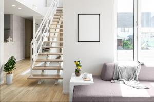 a white living room with stairs and a picture frame at The Prestige in Asahikawa