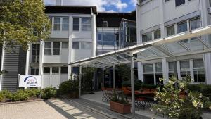 an external view of a building with a patio at Hotel Wörth in Wörth an der Isar
