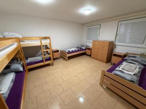 a dorm room with two bunk beds and twounks at Ubytování ProDante in Ostrava