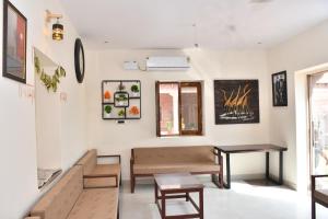 a living room with a couch and a table at Nova Heaven Villa in Daijar