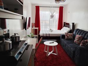 a small living room with a couch and a table at Tsavo in Nairobi
