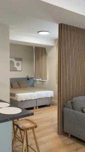 a living room with two beds and a couch at AH Residence Anička in KoÅ¡ickÃ© KÃºpele