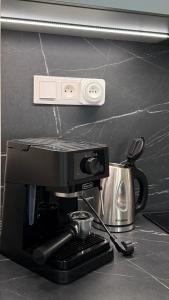 a coffee maker and a tea pot on a counter at AH Residence Anička in KoÅ¡ickÃ© KÃºpele