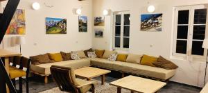 a living room with a couch and a table at Konak ispod Subjela in Ševrljuge