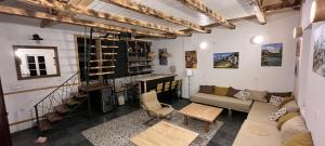 a living room with a couch and a table at Konak ispod Subjela in Ševrljuge +53 photos