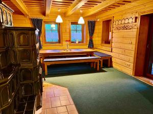 a bathroom with a bench in a wooden room at Chata Pod Kohůtkou in Nový Hrozenkov
