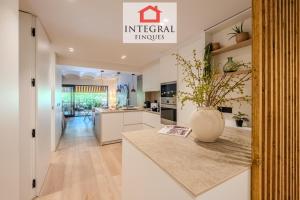 a kitchen with a counter with a vase on it at Apartament Eden Mar in Platja d'Aro