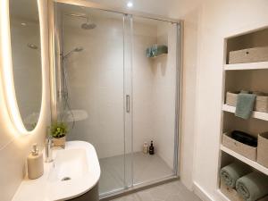 a bathroom with a shower and a sink at Cabris Village Escape - Junior Suite in Cabris