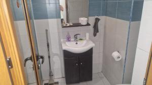 a small bathroom with a sink and a shower at Apart Complex Pontica - Sea View 20 in Chernomorets +15 photos