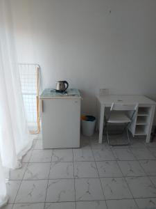 a kitchen with a table and a table and a table and a table at Ippocampo in Giardini Naxos