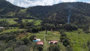 an aerial view of a house on a hill at Chalé Caminho Real in Itamonte