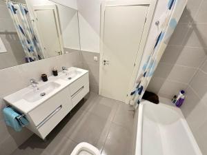 a bathroom with a sink and a toilet and a shower at Rooms Balmes in Barcelona
