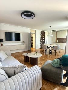 a living room with a couch and a table at BL Urban Stay in Starčevica