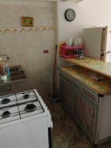 a kitchen with a stove and a counter top at Super star Chalet in Grand beach in Ras Sedr +1 photo