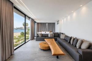 a living room with a couch and a table at Middle Beach Hotel in Jounieh