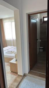 a room with a door leading to a bedroom at Stoyko's Guest House in Pomorie