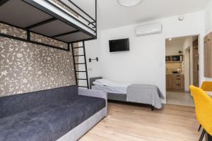 a bedroom with a bed in a room at ToTuLokum in Krakow