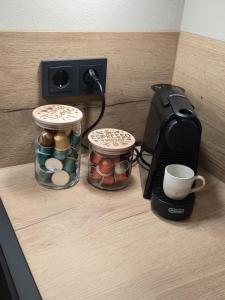 a counter with a coffee maker and a coffee cup at Ferienhaus Frida in Kleinich +15 photos