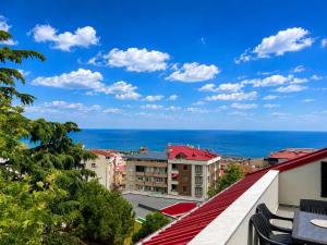 a view of the ocean from the balcony of a building at DidiHome City Center in Trabzon