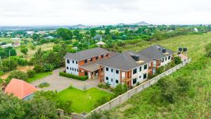 an aerial view of a house on a hill at Winsome Hotel Arusha in Themi