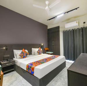 a bedroom with a large bed in a room at Luxury Hotel Aura Residency in Rāiwāla +12 photos