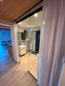 a room with a sliding glass door and a kitchen at Eibisch Apartments in Passau