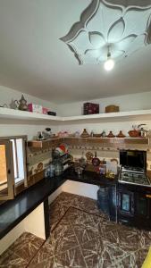 a kitchen with a counter top with a ceiling at Sidi kaouki Private House in Sidi Kaouki +19 photos