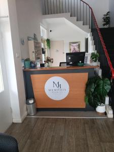 an office with a desk with a computer on it at Memphis Motor Inn- UNDER NEW MANAGEMENT in Parkes +58 photos