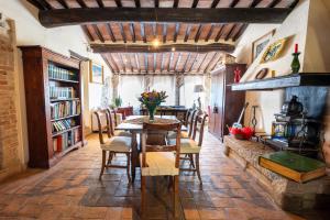 a dining room with a table and chairs at Podere Santa Maria in Monte Antico